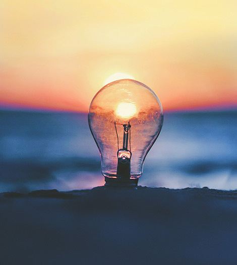 a-light-bulb-infront-of-sunset-on-a-beach-innovent-labs-africa